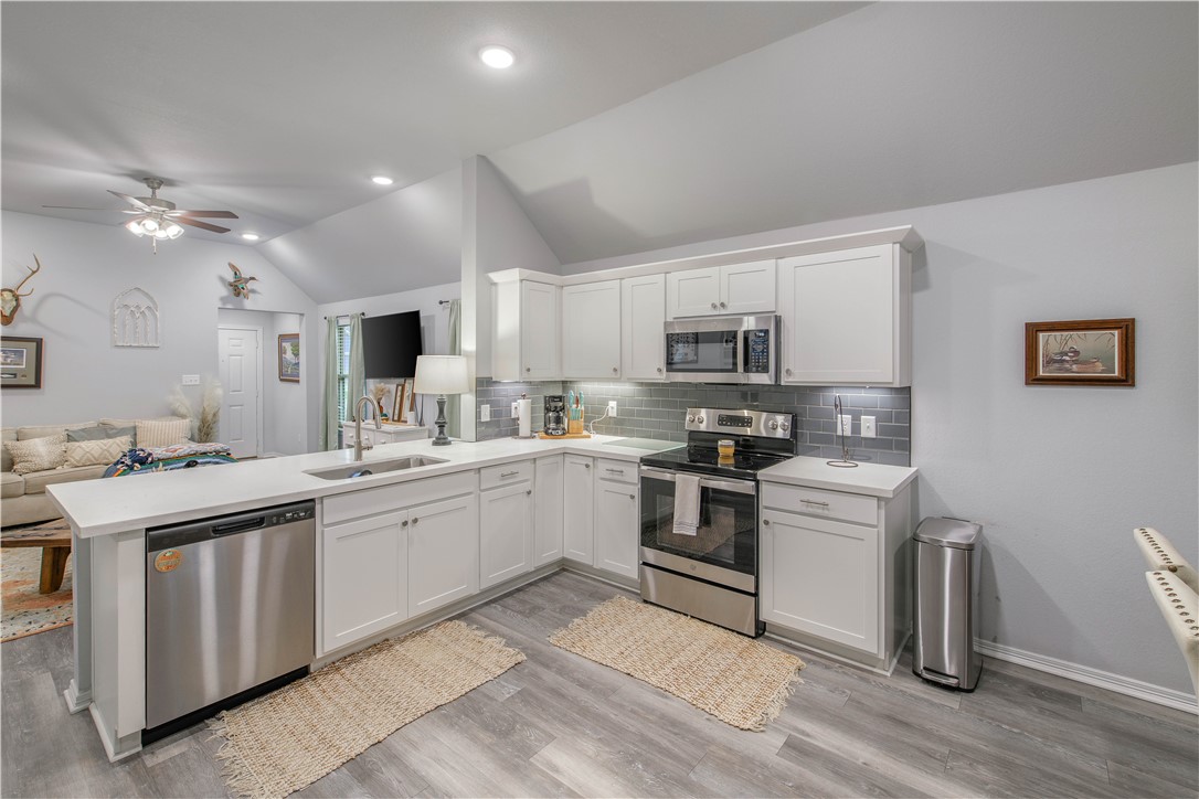 2850 Messenger Way Bryan, TX 77803 - Photo 6 of 17 a kitchen with granite countertop appliances cabinets and a sink