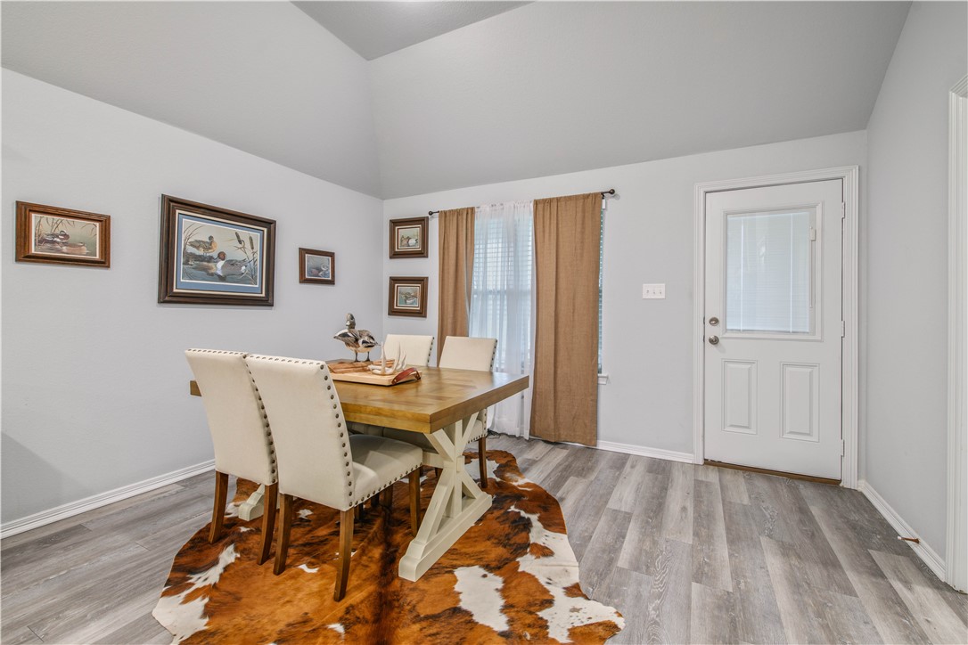 2850 Messenger Way Bryan, TX 77803 - Photo 8 of 17 a view of a dining room with furniture and wooden floor