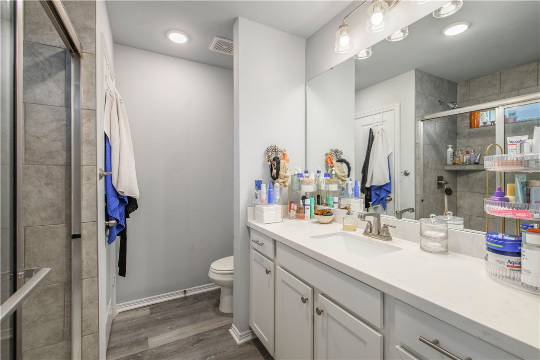 2850 Messenger Way Bryan, TX 77803 - Photo 10 of 17 a bathroom with a double vanity sink toilet and shower
