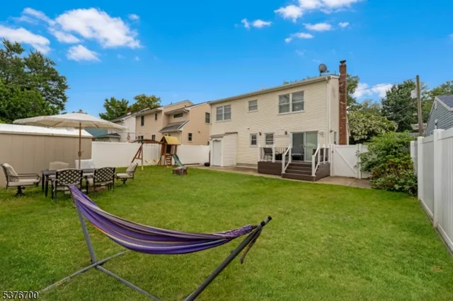 a view of a patio with table and chairs and potted plants
