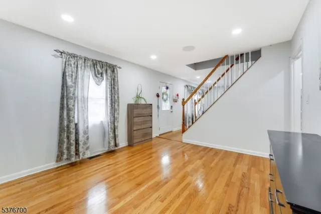 a view of entryway with wooden floor