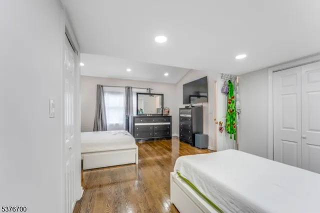 a bed room with a bed and a window