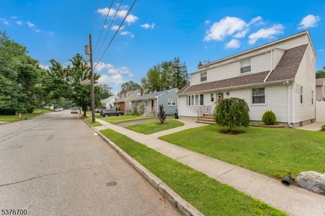 a couch sitting in front of a house