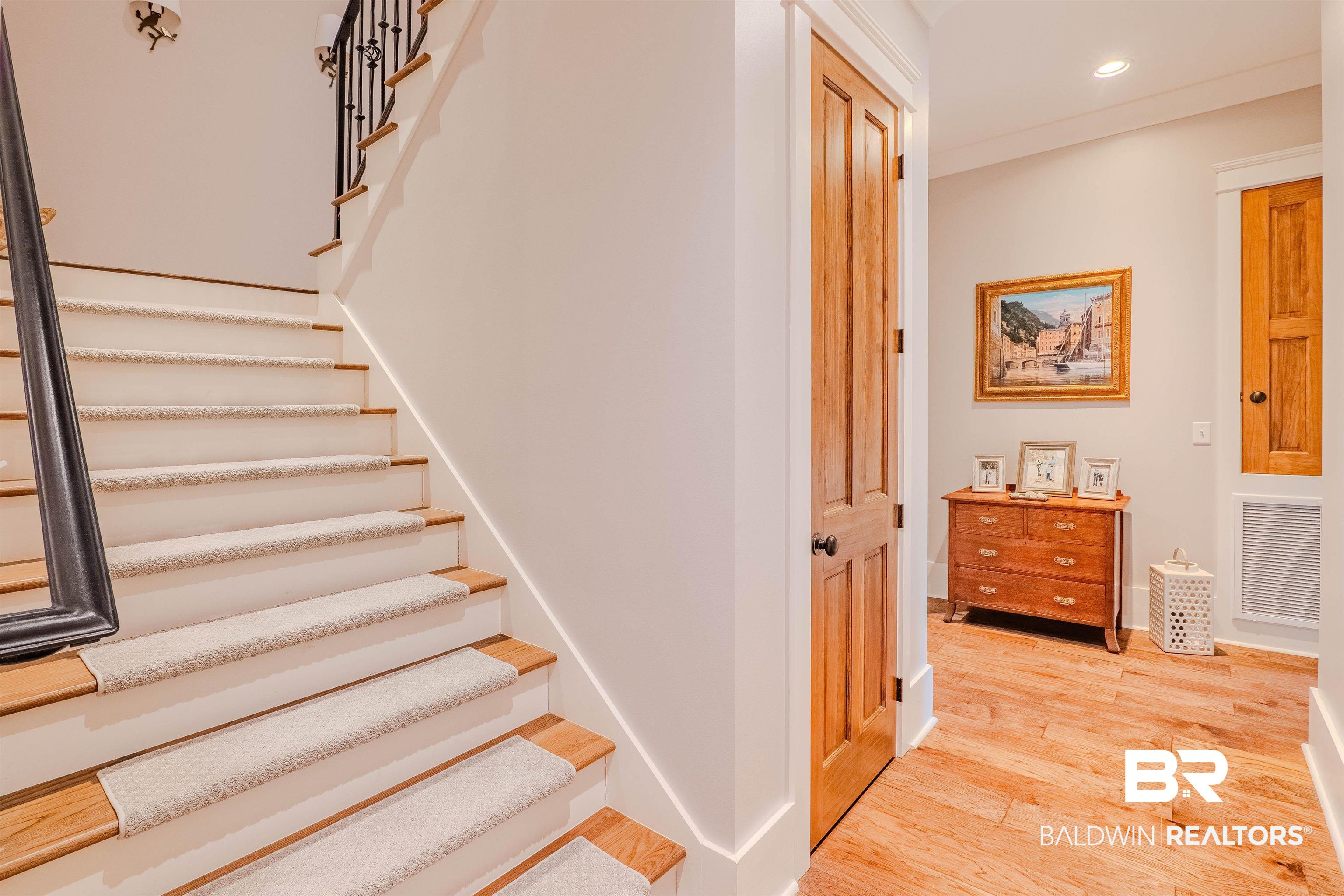 708 Manning Place Fairhope, AL 36532 - Photo 31 of 58 Stairway with wood-type flooring