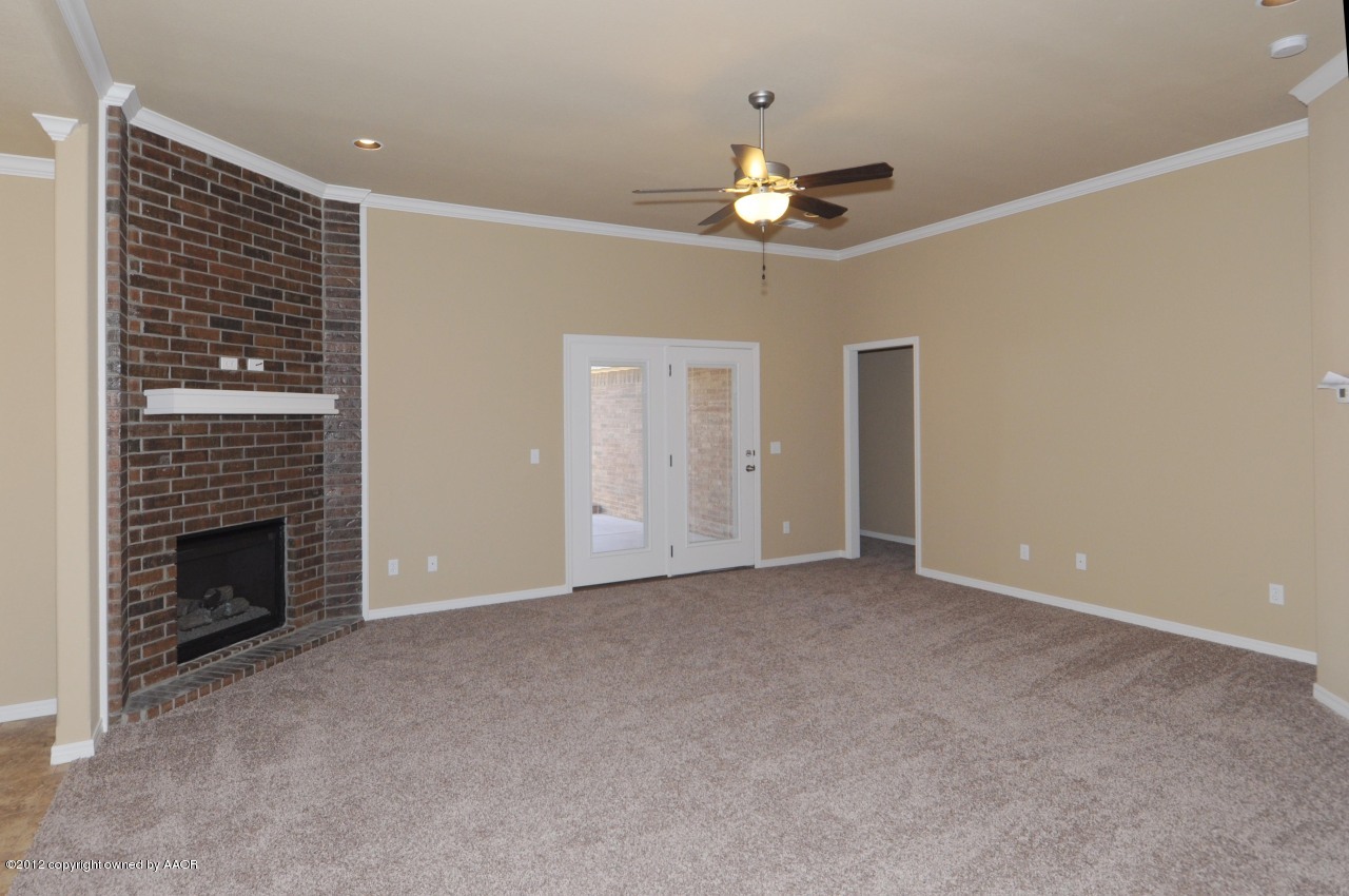 5903 South Rusk Street Amarillo, TX 79118 - Photo 2 of 16 a view of an empty room with a fireplace