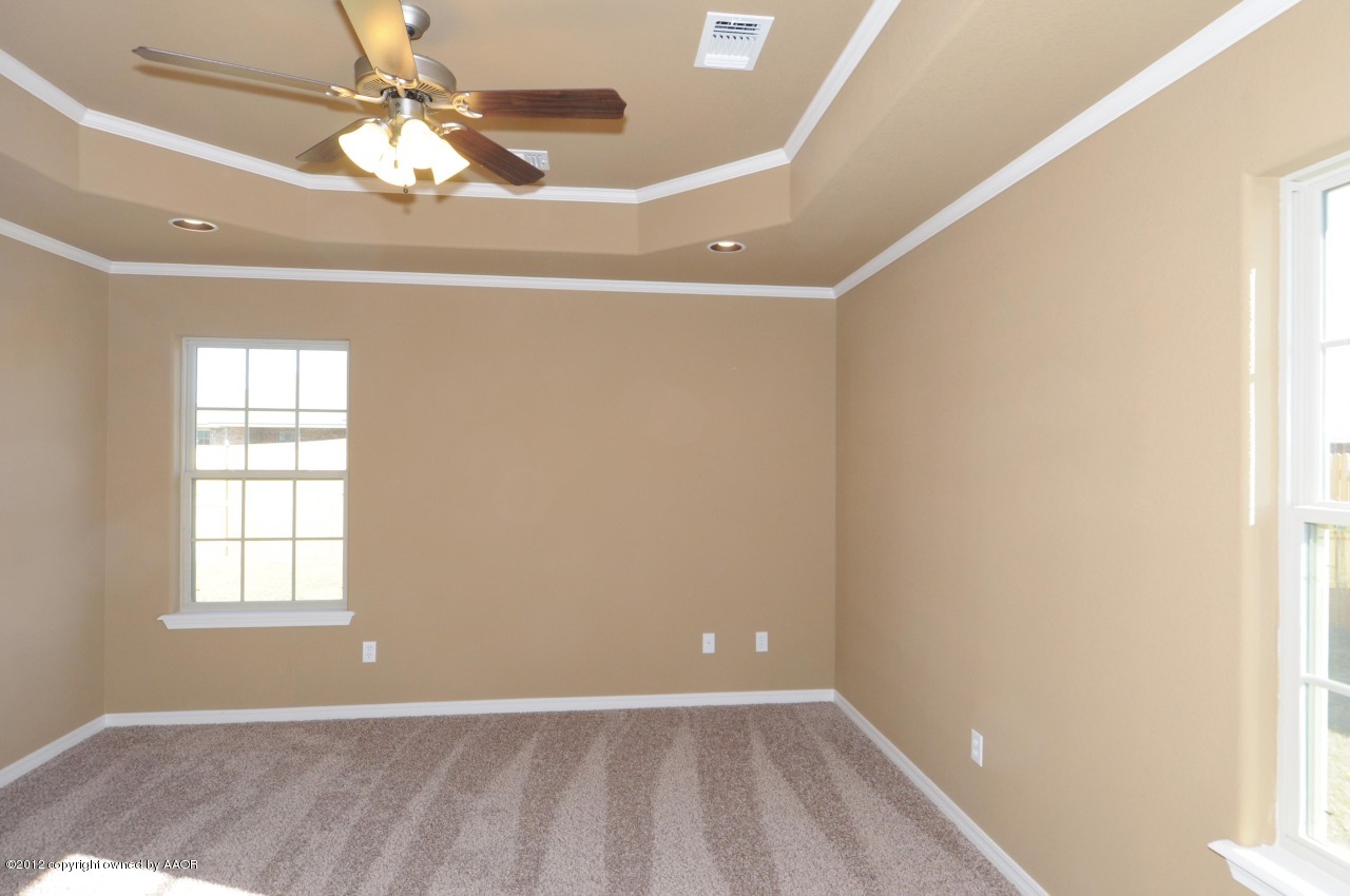 5903 South Rusk Street Amarillo, TX 79118 - Photo 13 of 16 an empty room with windows and fan