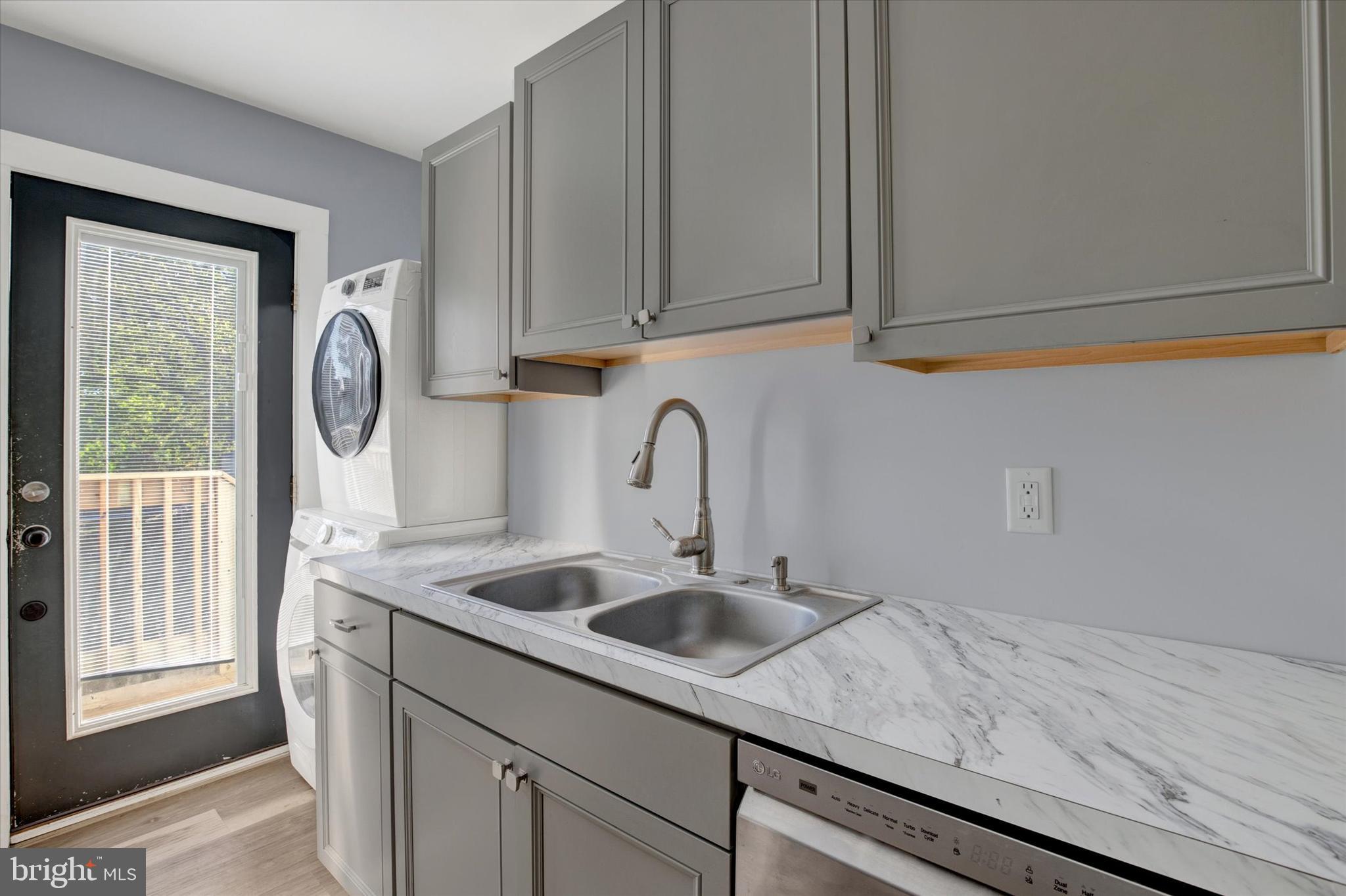 603 Ferry Street Sharptown, MD 21861 - Photo 12 of 28 a close view of sink a washer and dryer