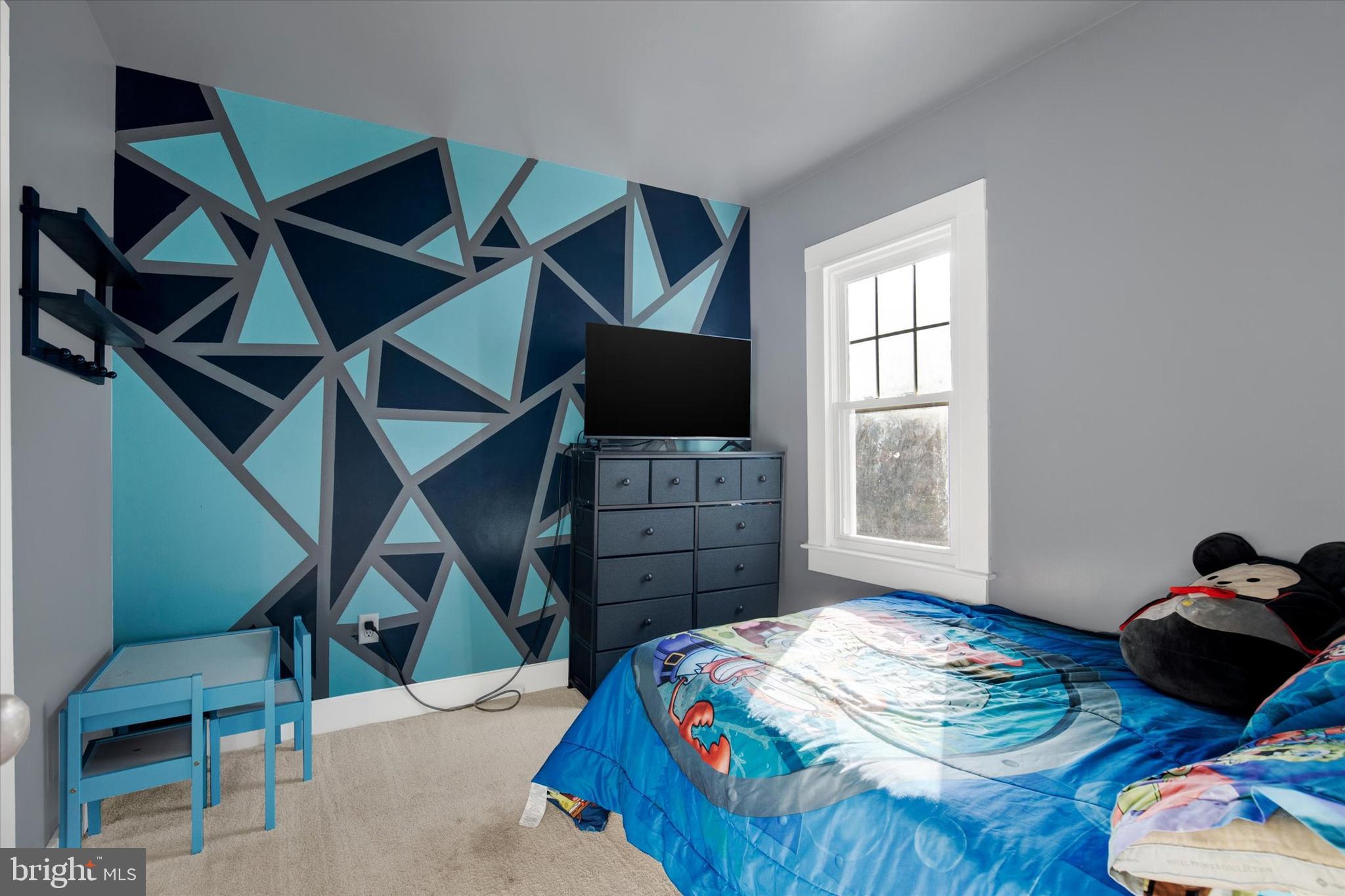 603 Ferry Street Sharptown, MD 21861 - Photo 20 of 28 a bedroom with a bed and a tv on the dresser