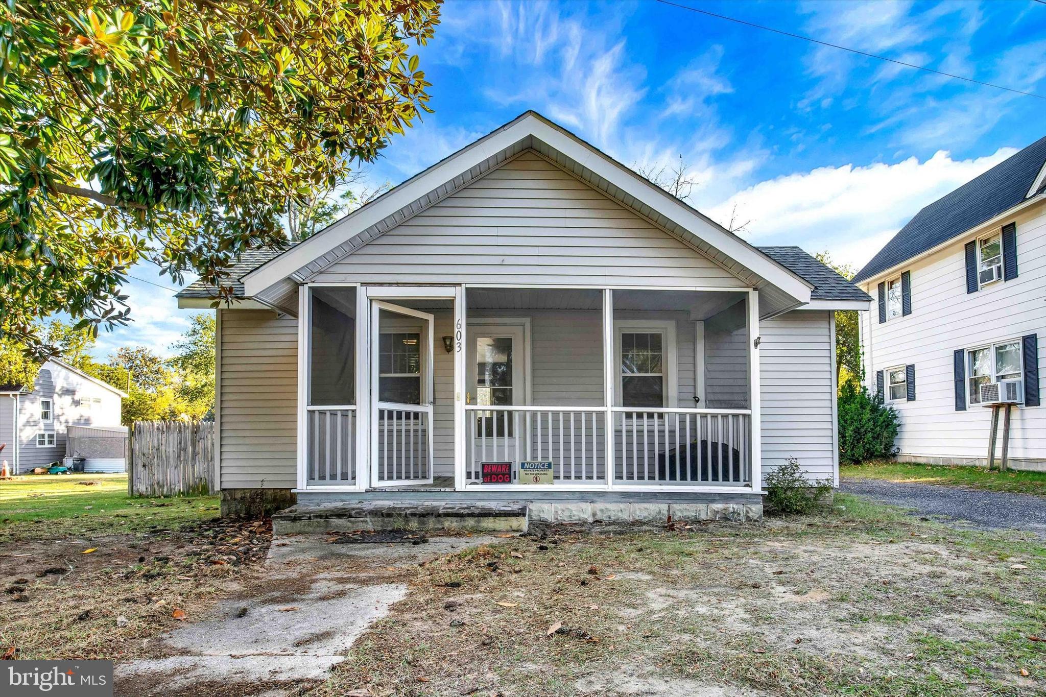 603 Ferry Street Sharptown, MD 21861 - Photo 2 of 28 a front view of a house with a garden