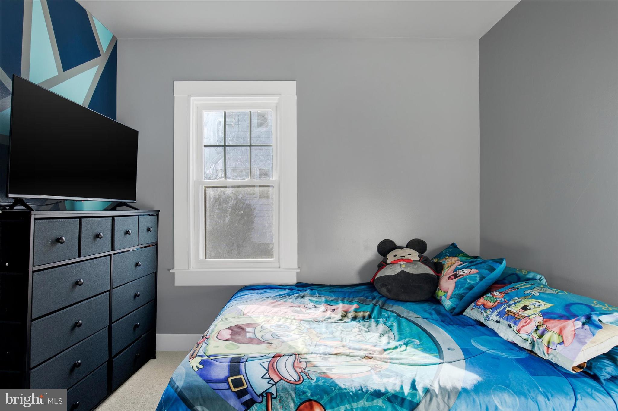 603 Ferry Street Sharptown, MD 21861 - Photo 21 of 28 a bedroom with a bed and flat screen tv