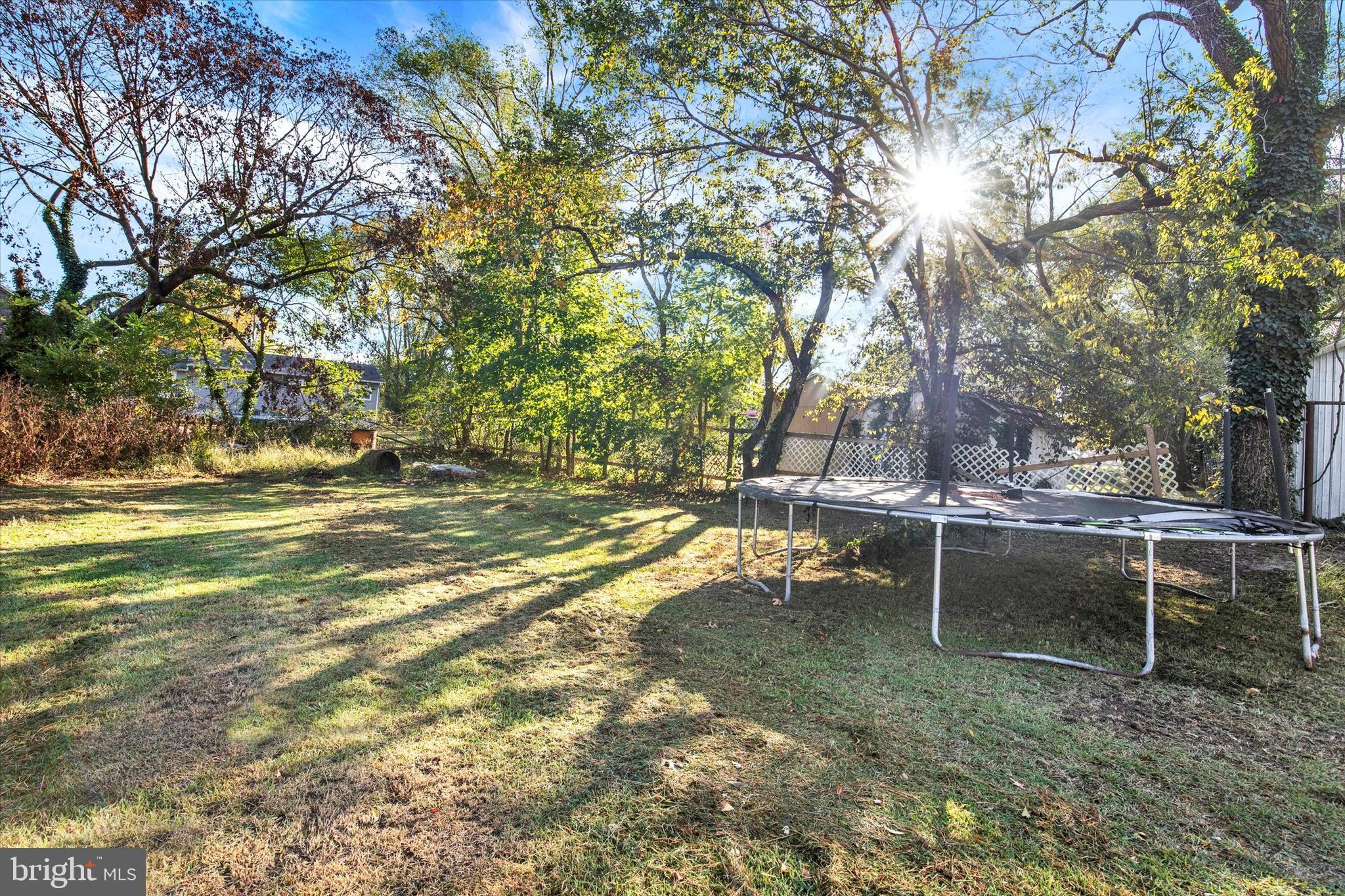 603 Ferry Street Sharptown, MD 21861 - Photo 27 of 28 a backyard of a house with table and chairs