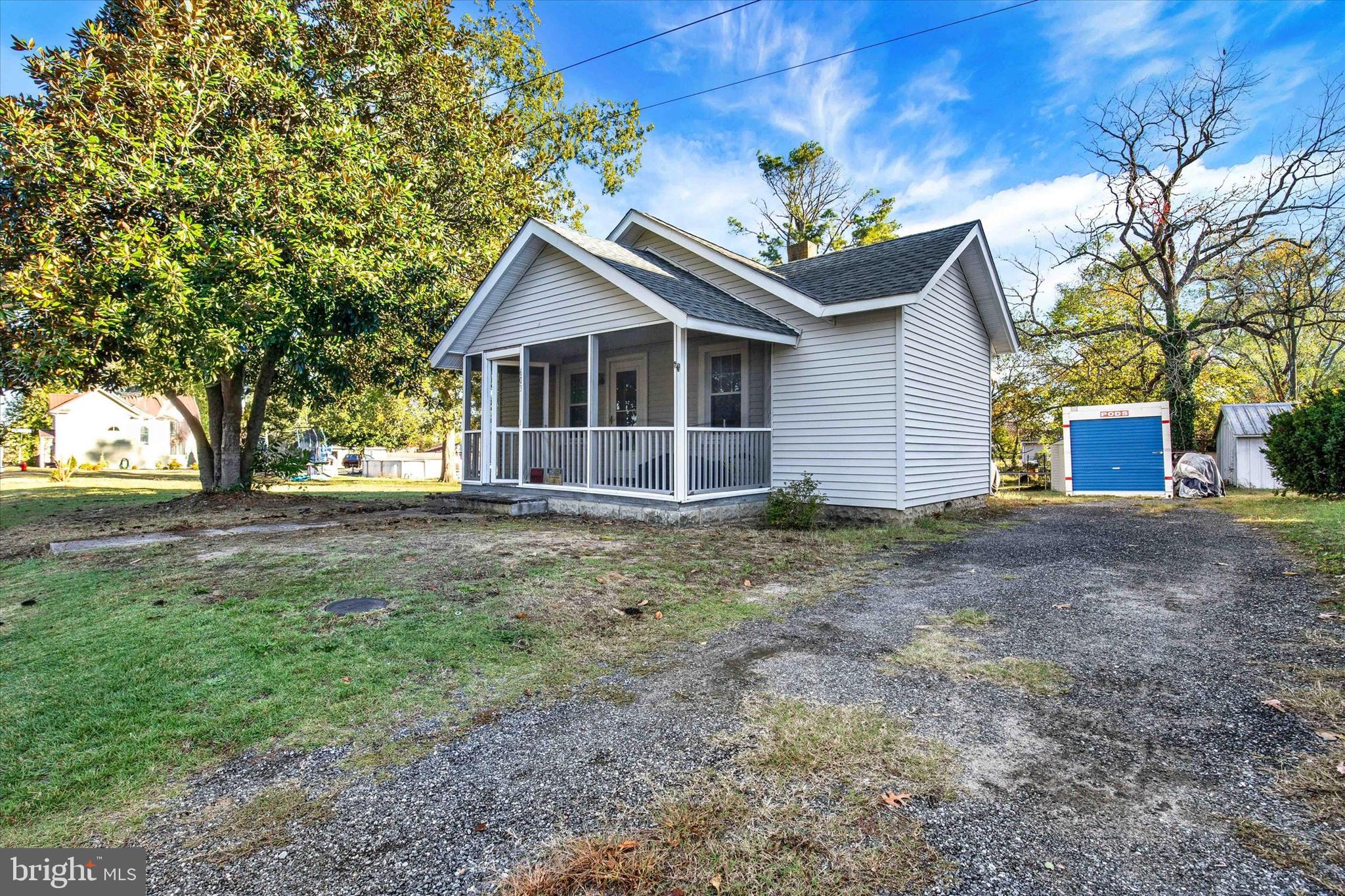 603 Ferry Street Sharptown, MD 21861 - Photo 4 of 28 a front view of a house with a garden