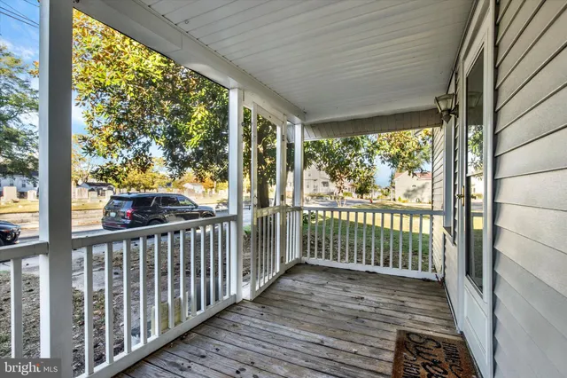 a view of a porch with wooden floor