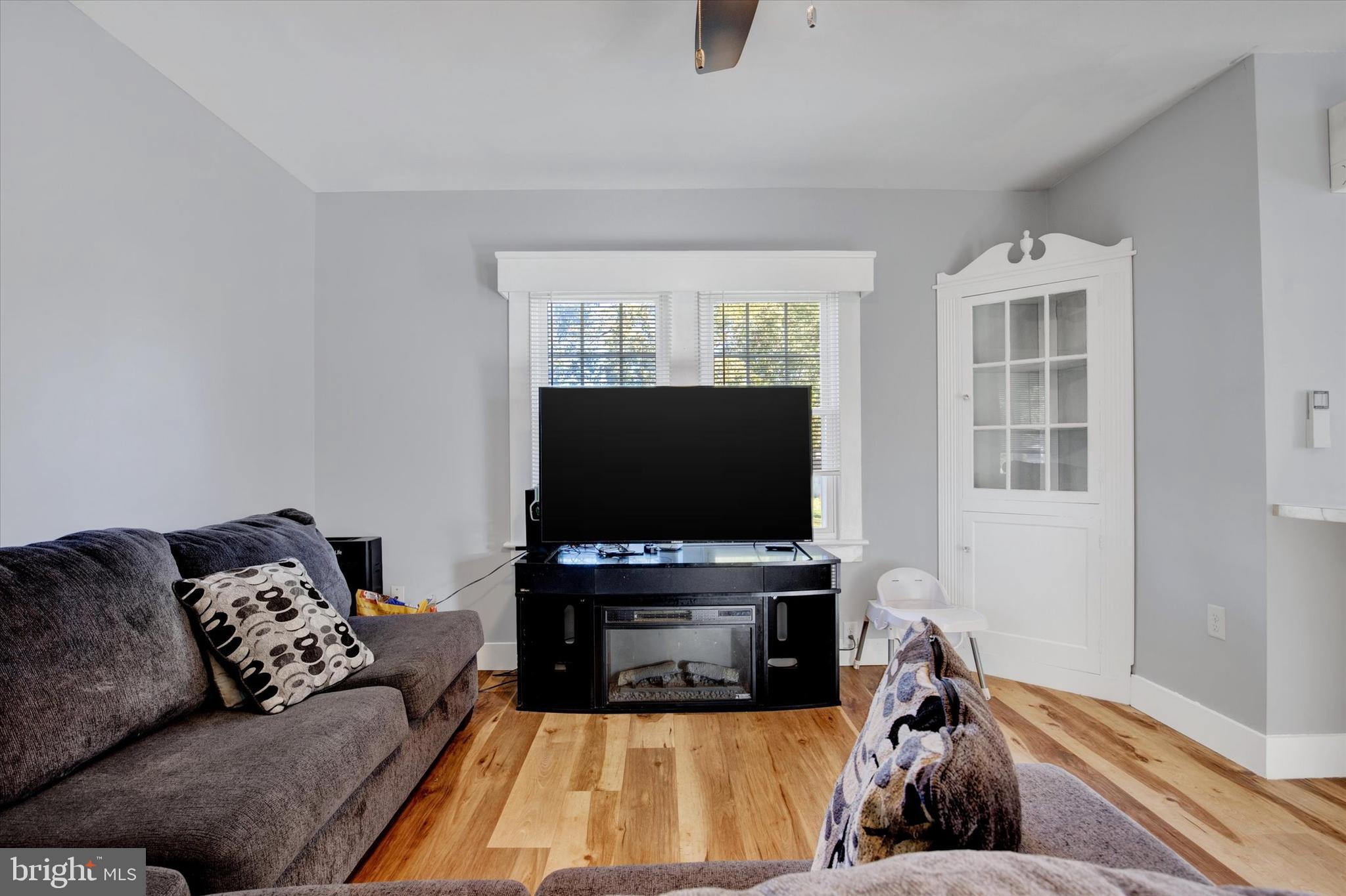 603 Ferry Street Sharptown, MD 21861 - Photo 8 of 28 a living room with furniture and a flat screen tv