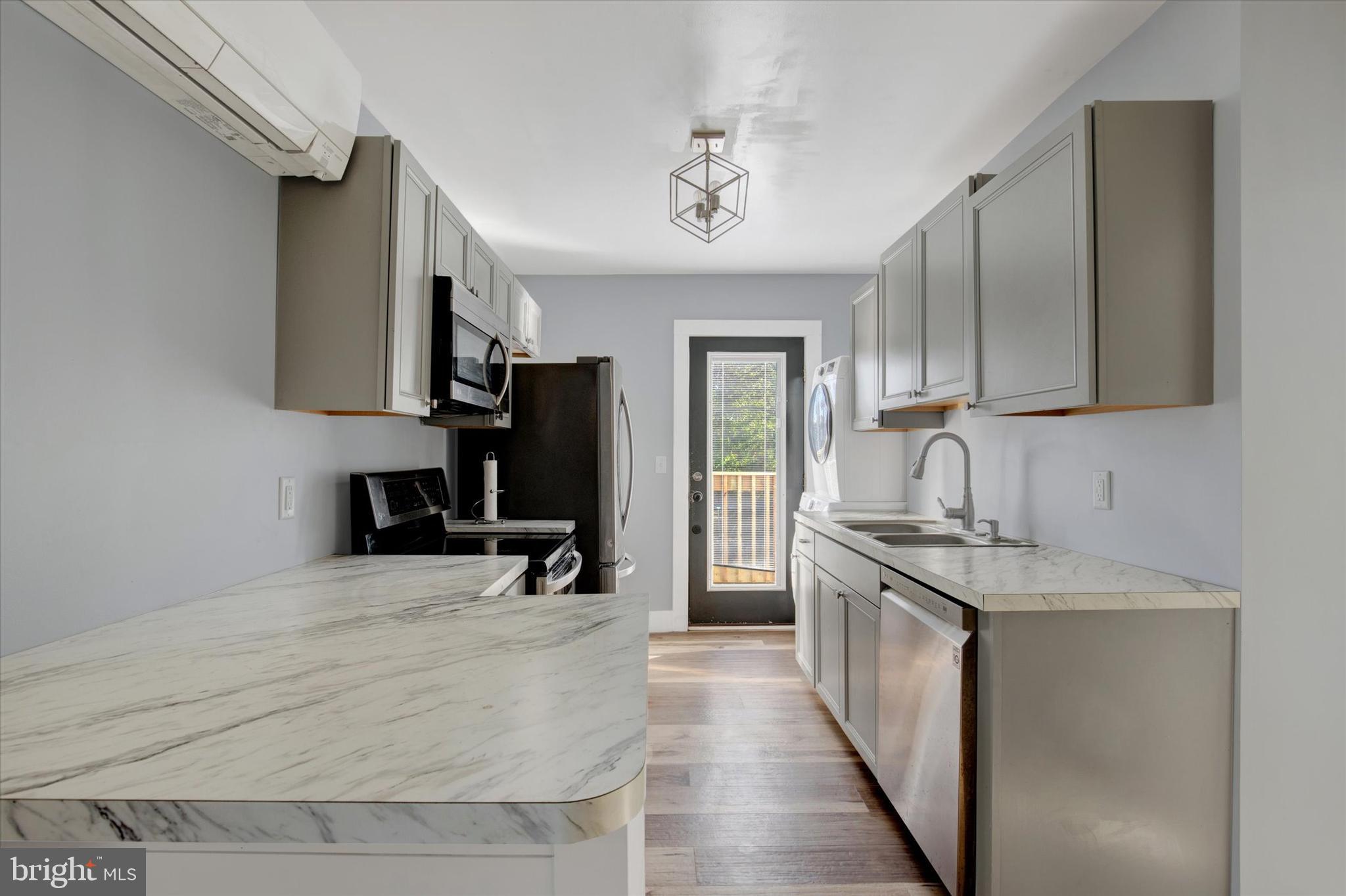 603 Ferry Street Sharptown, MD 21861 - Photo 10 of 28 a kitchen with a stove a refrigerator and a sink