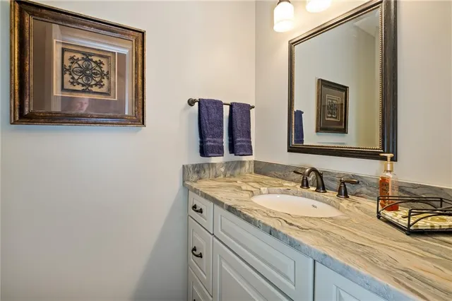 a bathroom with a sink and a mirror