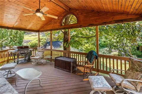 a outdoor space with wooden floor and outdoor seating