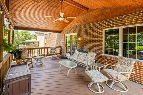 a view of a patio with table and chairs