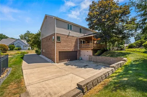 a view of a street with potted plants