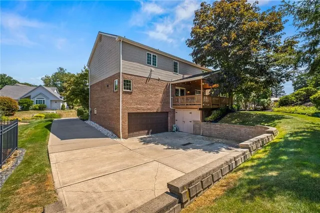 a view of a street with potted plants