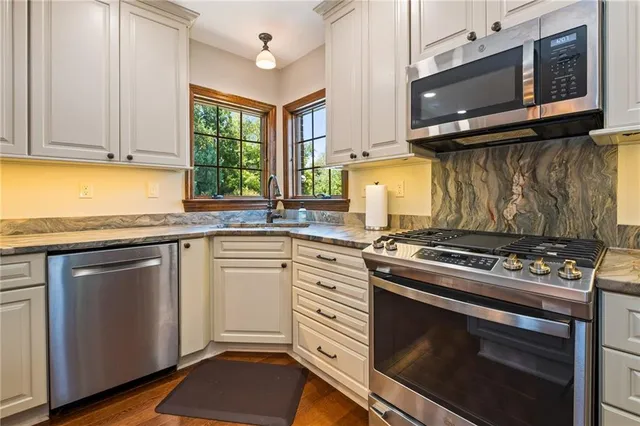 a kitchen with a stove and a microwave