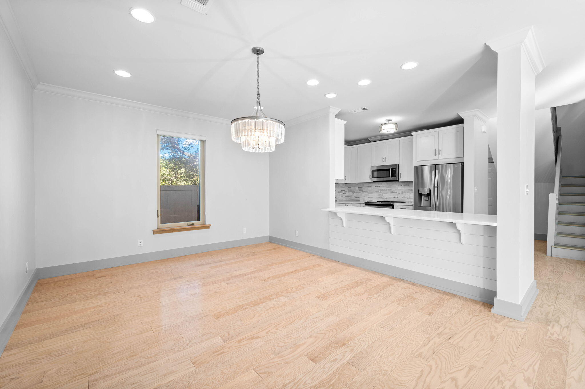 18 Sand Cliffs Drive Inlet Beach, FL 32461 - Photo 11 of 56 a view of kitchen with stainless steel appliances granite countertop a stove top oven a sink dishwasher a refrigerator and white cabinets with wooden floor