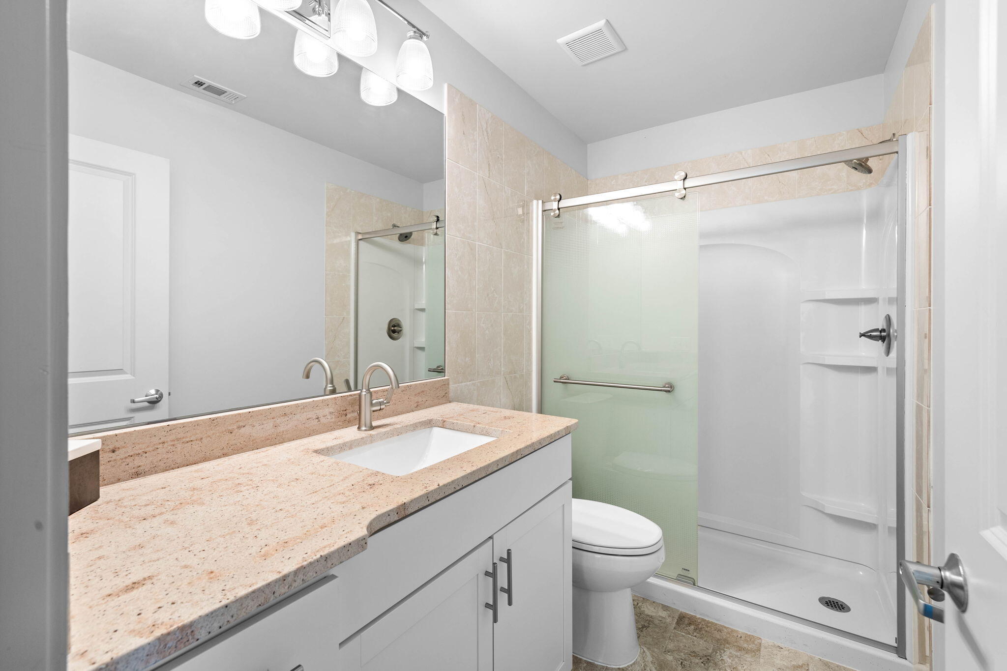 18 Sand Cliffs Drive Inlet Beach, FL 32461 - Photo 31 of 56 a bathroom with a granite countertop sink toilet and shower