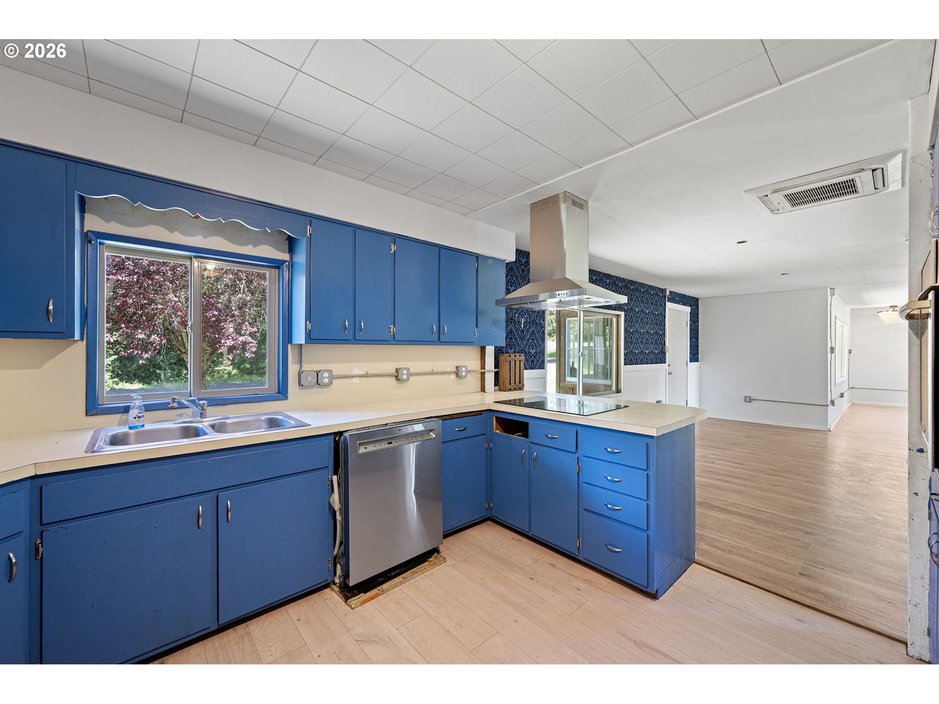 77521 Brock Road Oakridge, OR 97463 - Photo 12 of 48 a kitchen with stainless steel appliances granite countertop wooden cabinets a sink and dishwasher with wooden floor