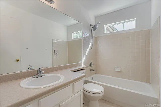 a bathroom with a sink a toilet and a bathtub