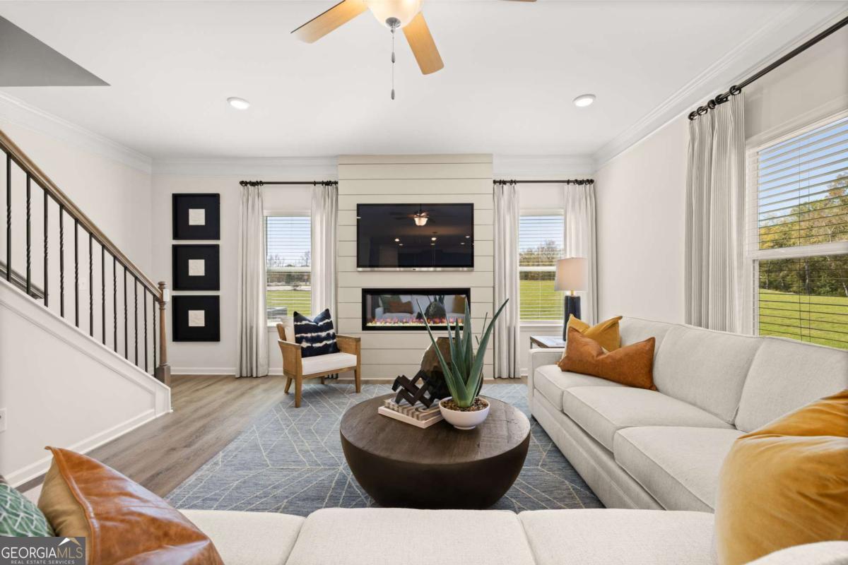 234 Shantz Way, Unit (LOT A34) Byron, GA 31008 - Photo 13 of 23 a living room with fireplace and a couch