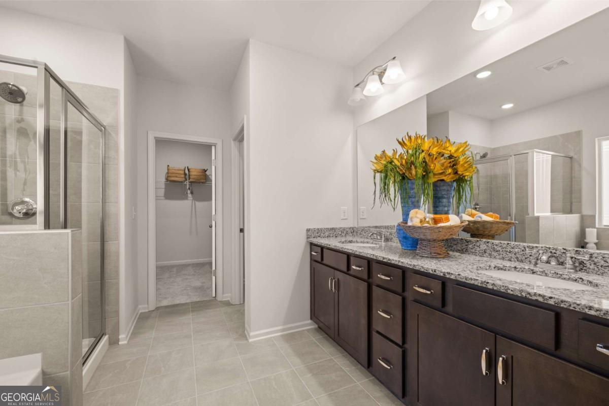 234 Shantz Way, Unit (LOT A34) Byron, GA 31008 - Photo 16 of 23 a bathroom with a granite countertop sink and a mirror