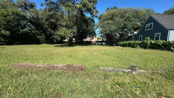 a view of outdoor space with deck and yard