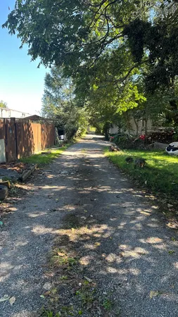 a backyard of a house with lots of green space