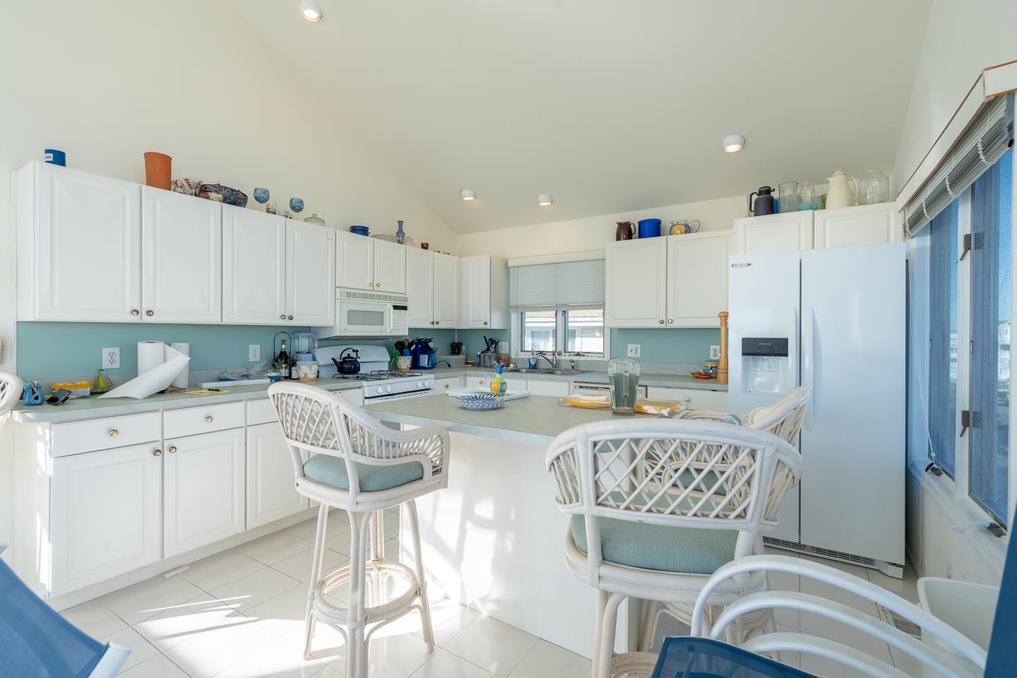 12 82nd Street, Unit NORTH Sea Isle City, NJ 08243 - Photo 11 of 26 a kitchen with stainless steel appliances granite countertop a table and chairs