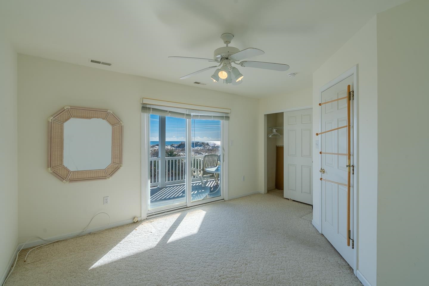12 82nd Street, Unit NORTH Sea Isle City, NJ 08243 - Photo 13 of 26 an empty room with chandelier fan and windows