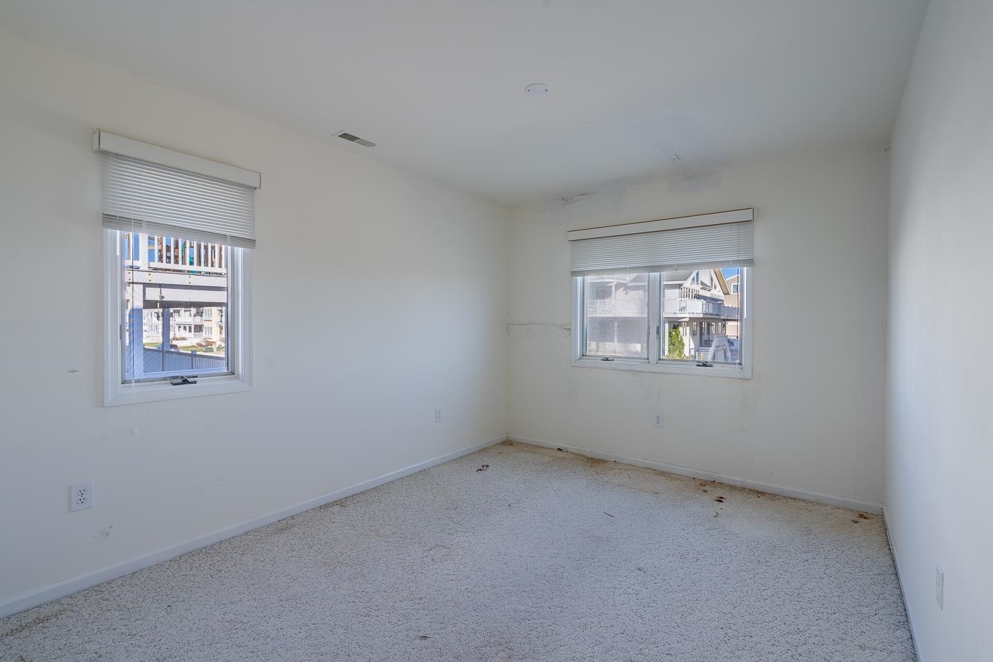 12 82nd Street, Unit NORTH Sea Isle City, NJ 08243 - Photo 16 of 26 an empty room with a window