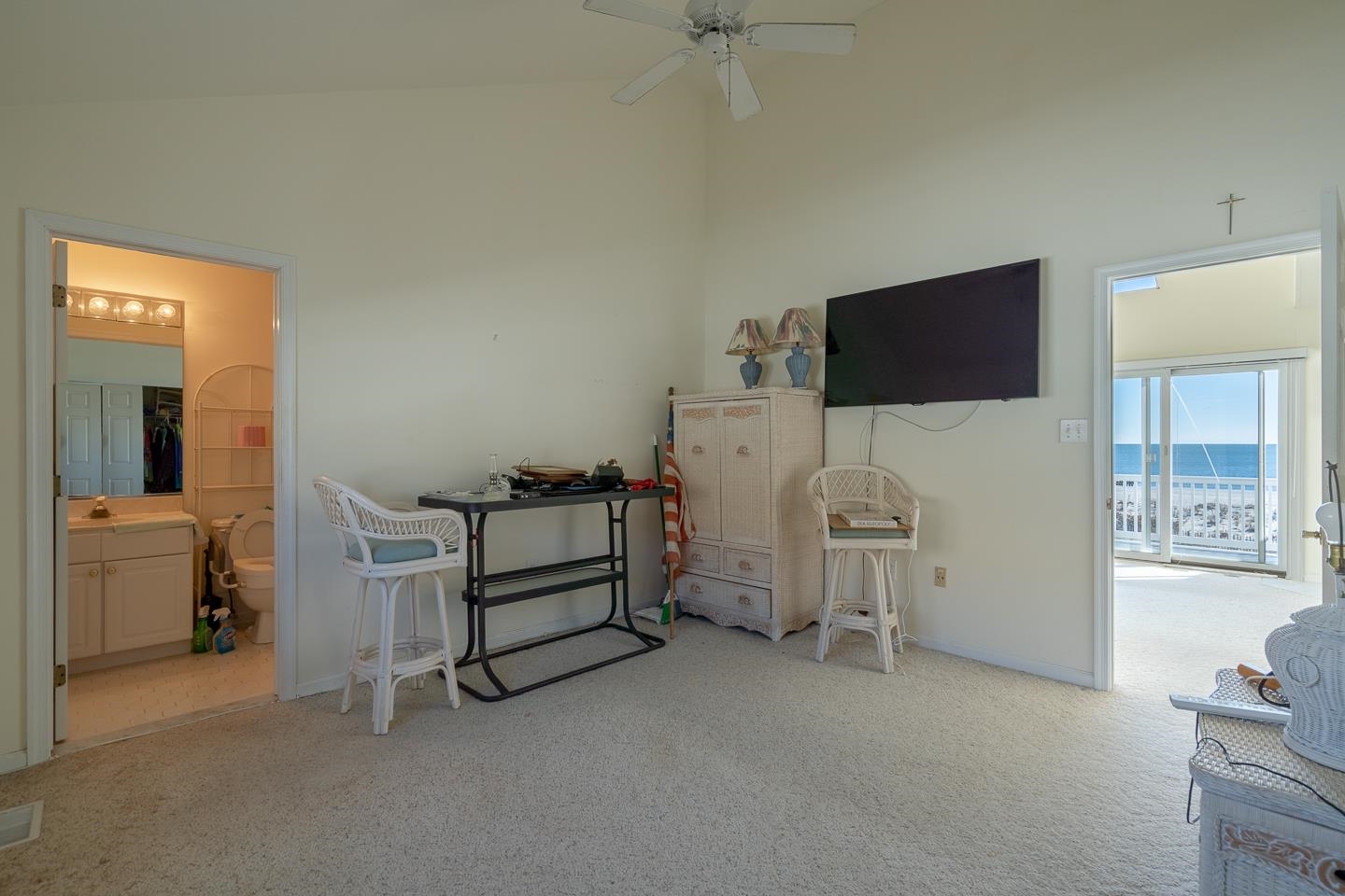 12 82nd Street, Unit NORTH Sea Isle City, NJ 08243 - Photo 17 of 26 a view of a livingroom with furniture and a flat screen tv