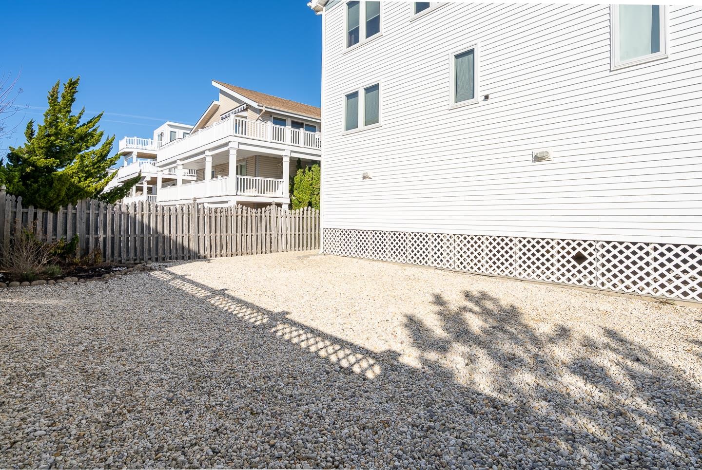 12 82nd Street, Unit NORTH Sea Isle City, NJ 08243 - Photo 23 of 26 a view of a house with a backyard