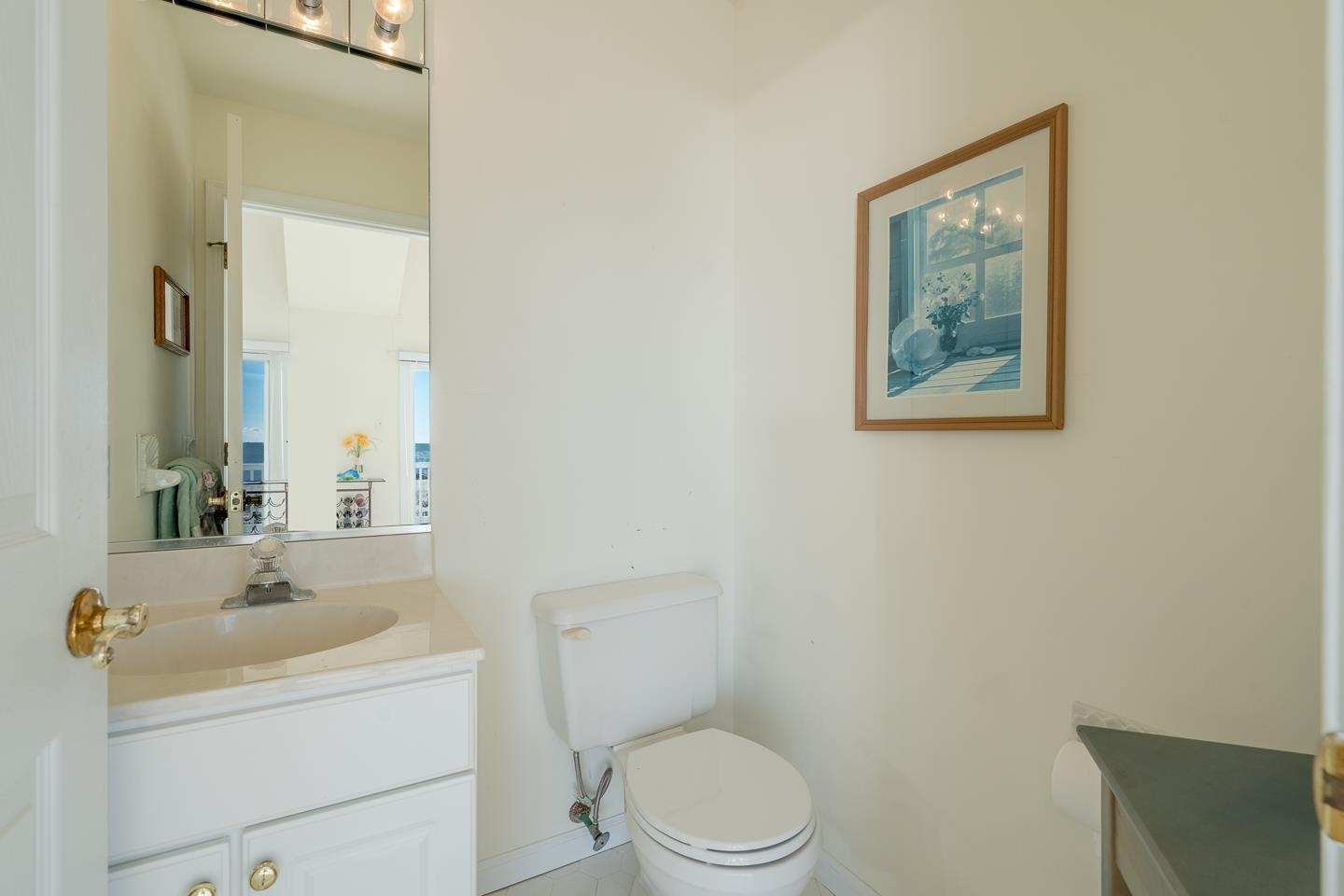 12 82nd Street, Unit NORTH Sea Isle City, NJ 08243 - Photo 24 of 26 a bathroom with a toilet sink and mirror