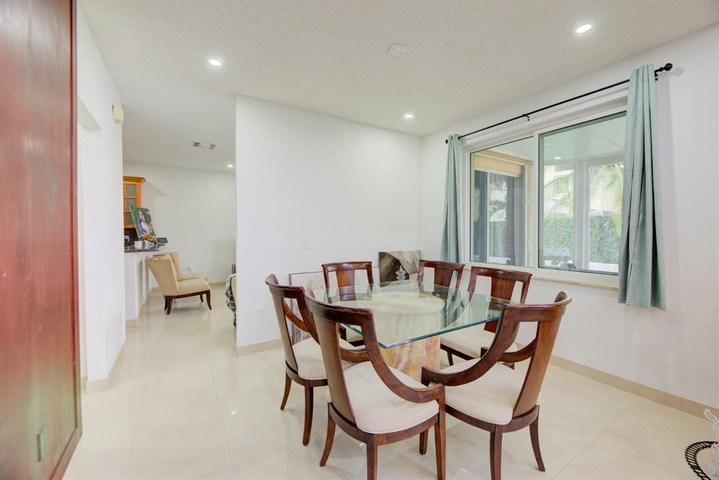 724 Northwest 155th Terrace Pembroke Pines, FL 33028 - Photo 11 of 46 a dining room with furniture and window