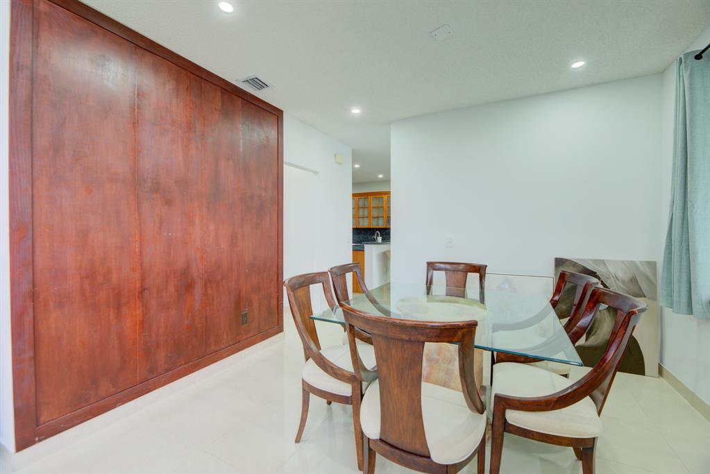 724 Northwest 155th Terrace Pembroke Pines, FL 33028 - Photo 12 of 46 a view of a dining room with furniture