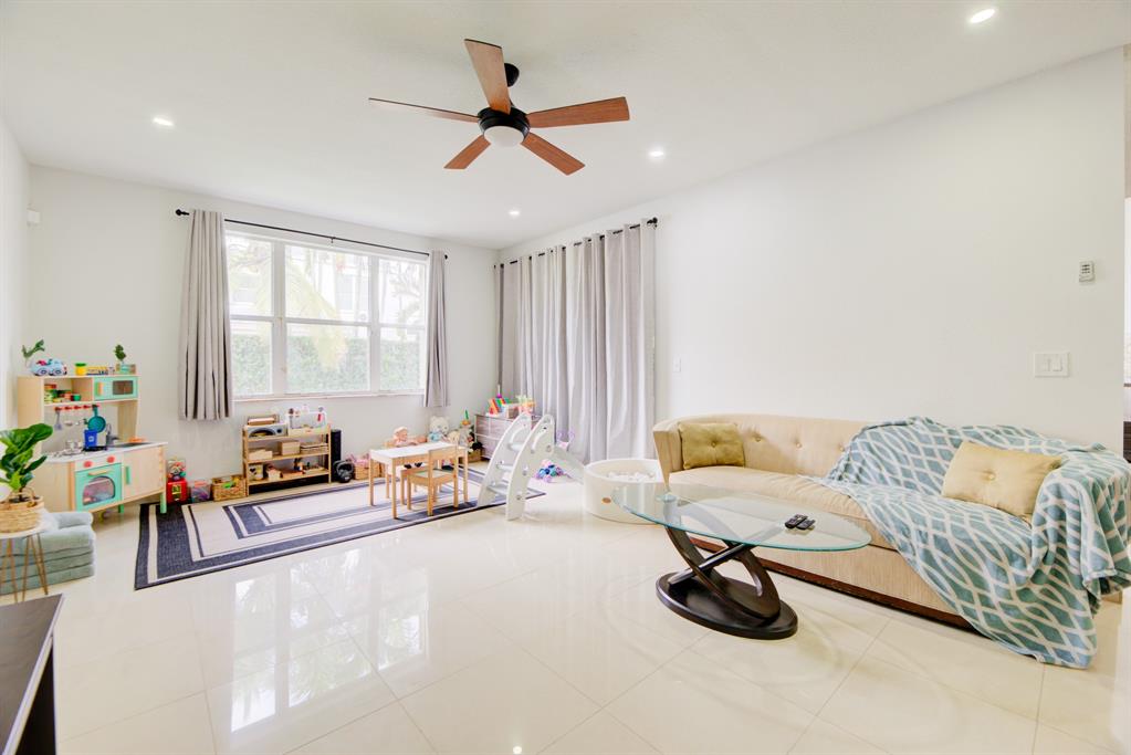 724 Northwest 155th Terrace Pembroke Pines, FL 33028 - Photo 15 of 46 a bedroom with furniture and a window