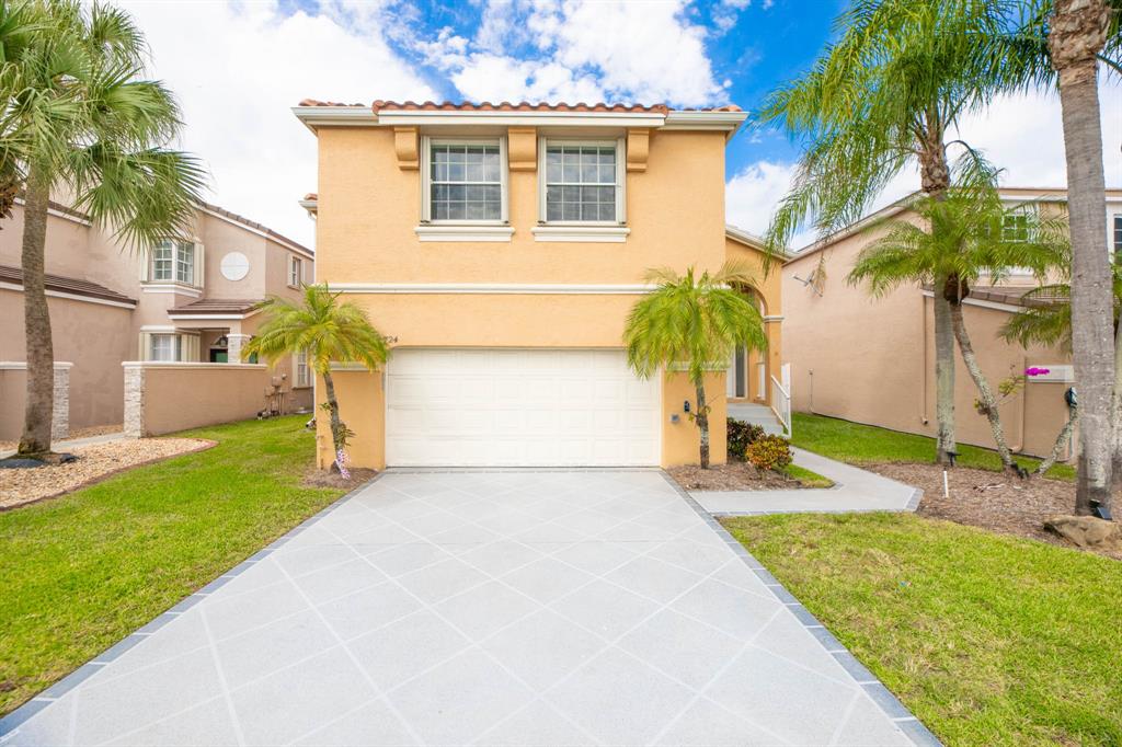 724 Northwest 155th Terrace Pembroke Pines, FL 33028 - Photo 2 of 46 a view of a house with a backyard