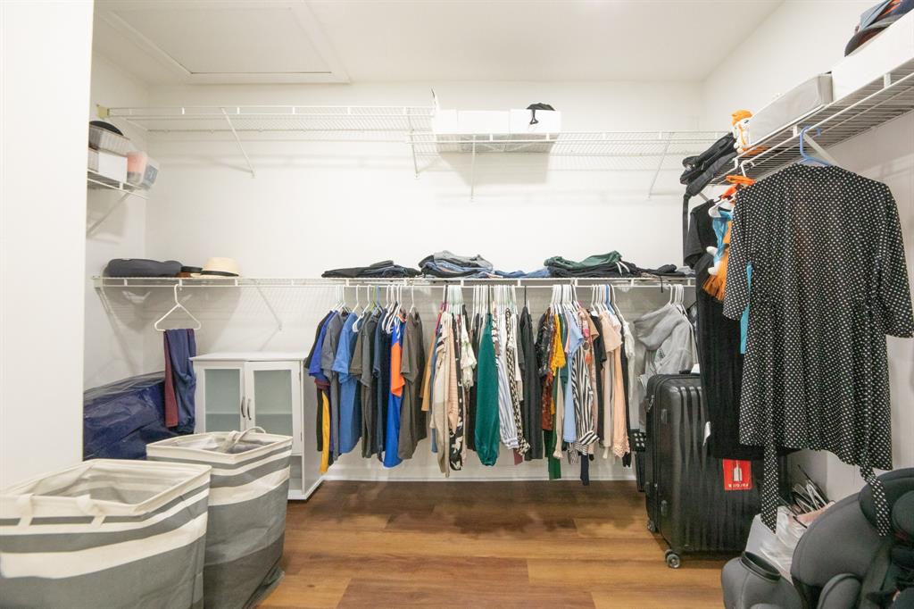 724 Northwest 155th Terrace Pembroke Pines, FL 33028 - Photo 27 of 46 a view of walk in closet with clothes and shoes
