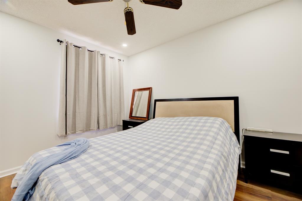 724 Northwest 155th Terrace Pembroke Pines, FL 33028 - Photo 29 of 46 a large bed sitting in a bedroom next to a window