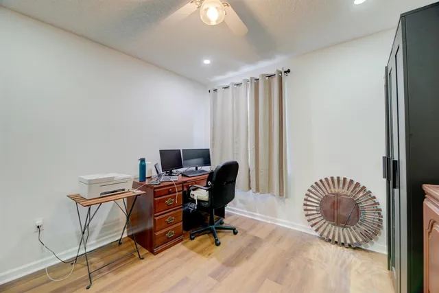 a workspace with furniture and a window