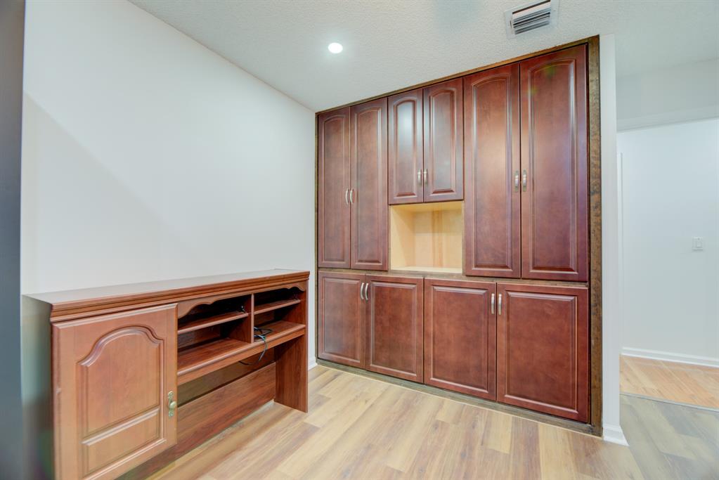 724 Northwest 155th Terrace Pembroke Pines, FL 33028 - Photo 36 of 46 a view of an empty room with wooden floor and a window