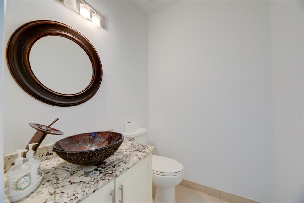 724 Northwest 155th Terrace Pembroke Pines, FL 33028 - Photo 37 of 46 a bathroom with a granite countertop sink and a mirror