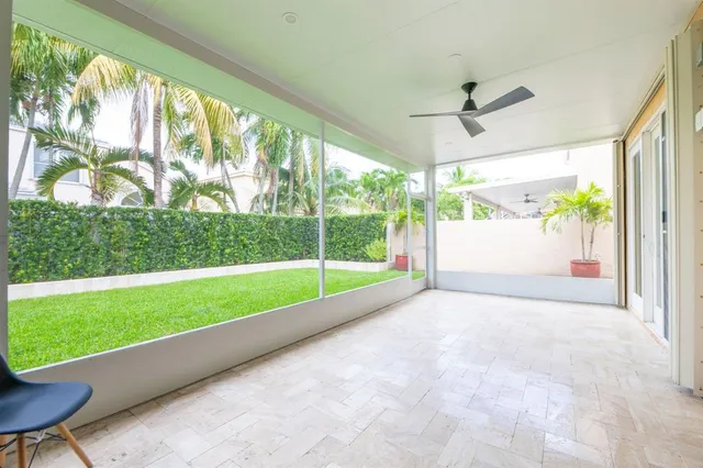 a view of a house with a yard and a garden