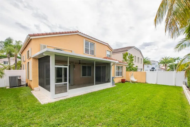 a front view of a house with a yard table and chairs